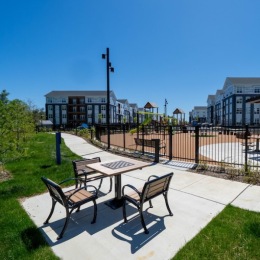 a park with a table and chairs