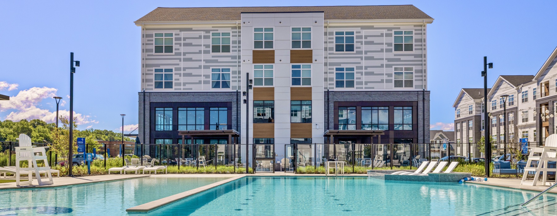 Sparkling swimming pool with James Run clubhouse in the background