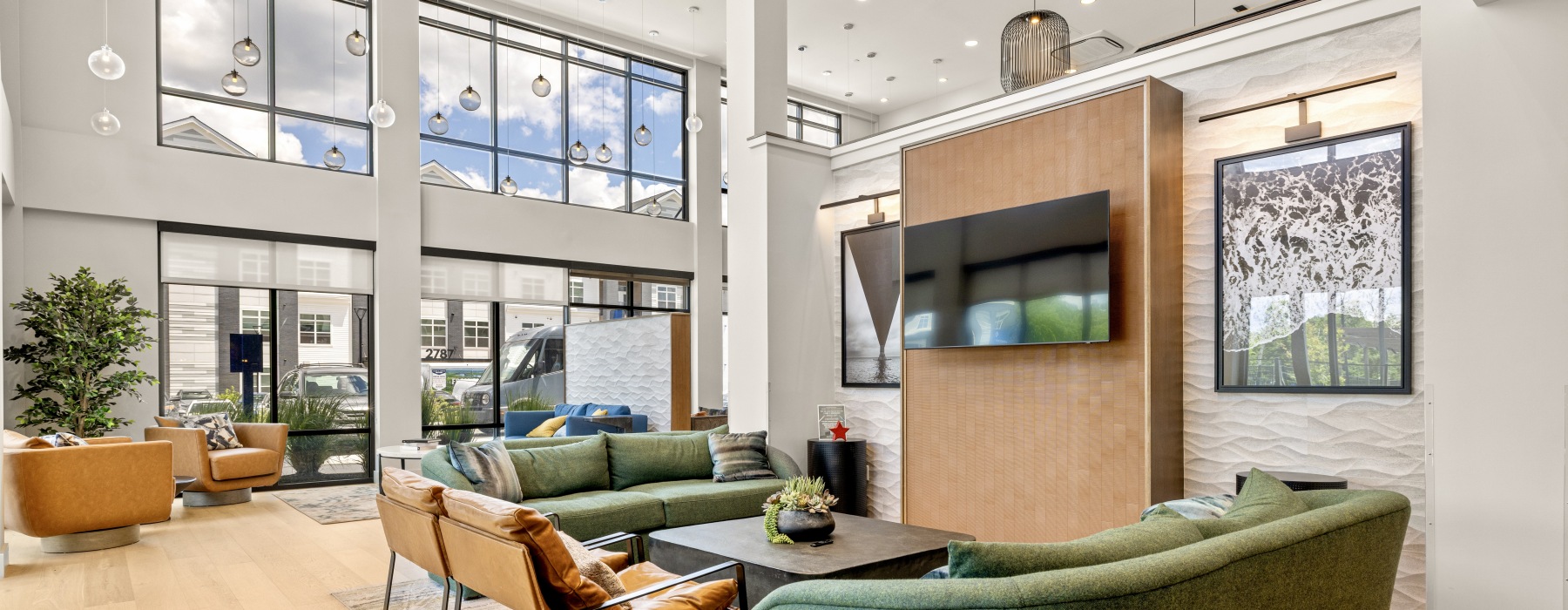 a seating area with a tv in the clubhouse