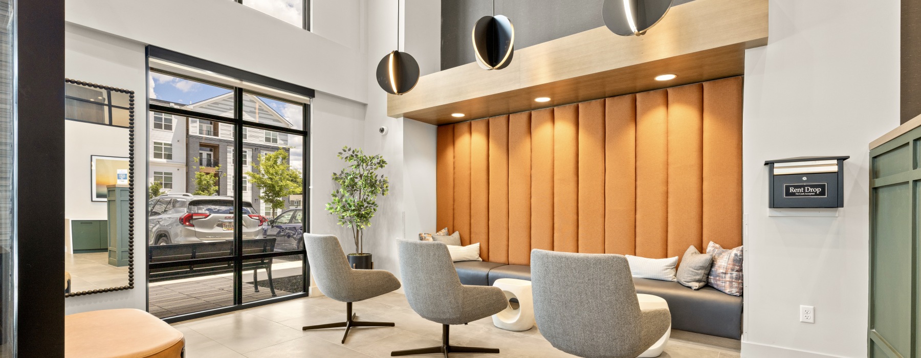 a spacious lit lobby of james run apartments