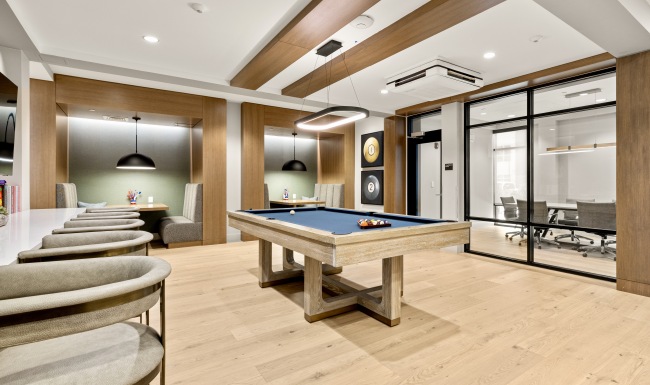 a pool table in a clubhouse room