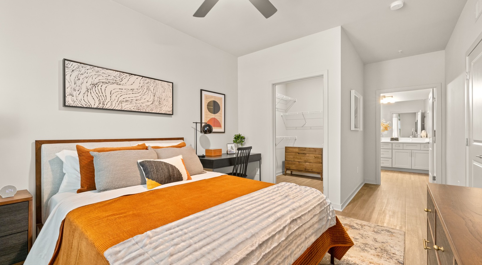 A bedroom with walk-in closet and ensuite bathroom