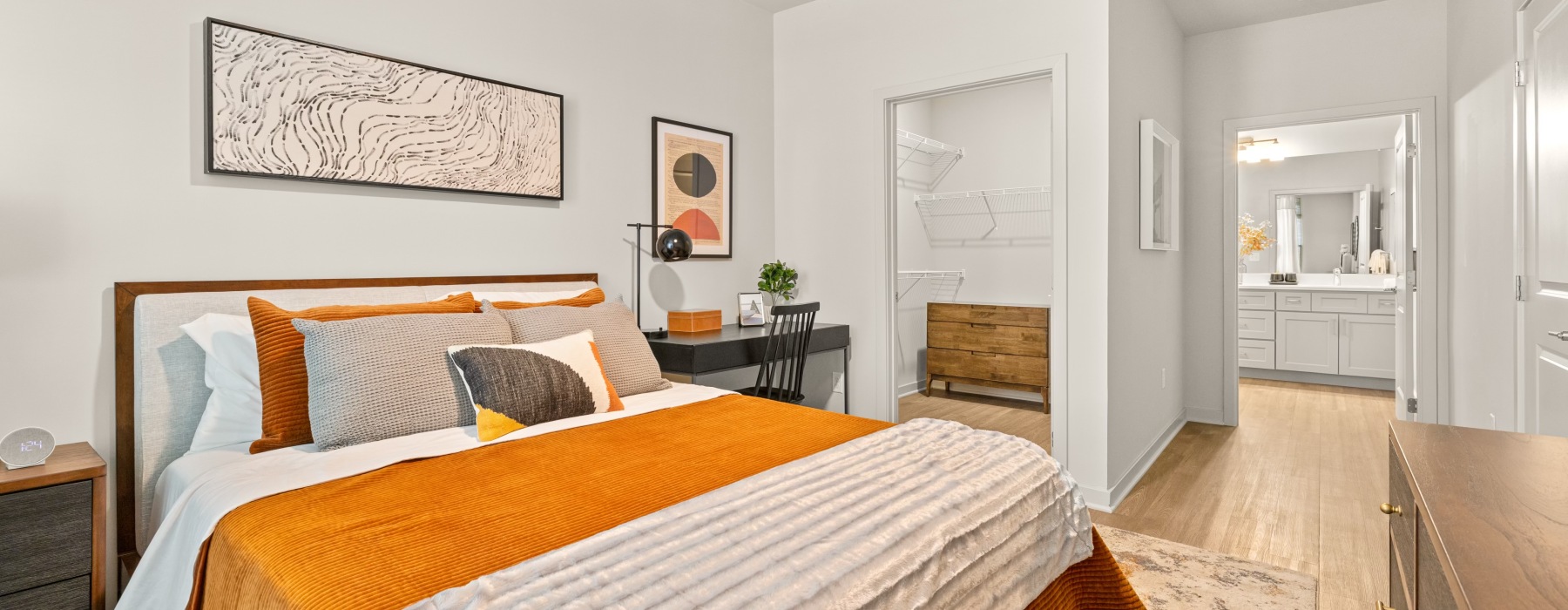 A bedroom with walk-in closet and ensuite bathroom